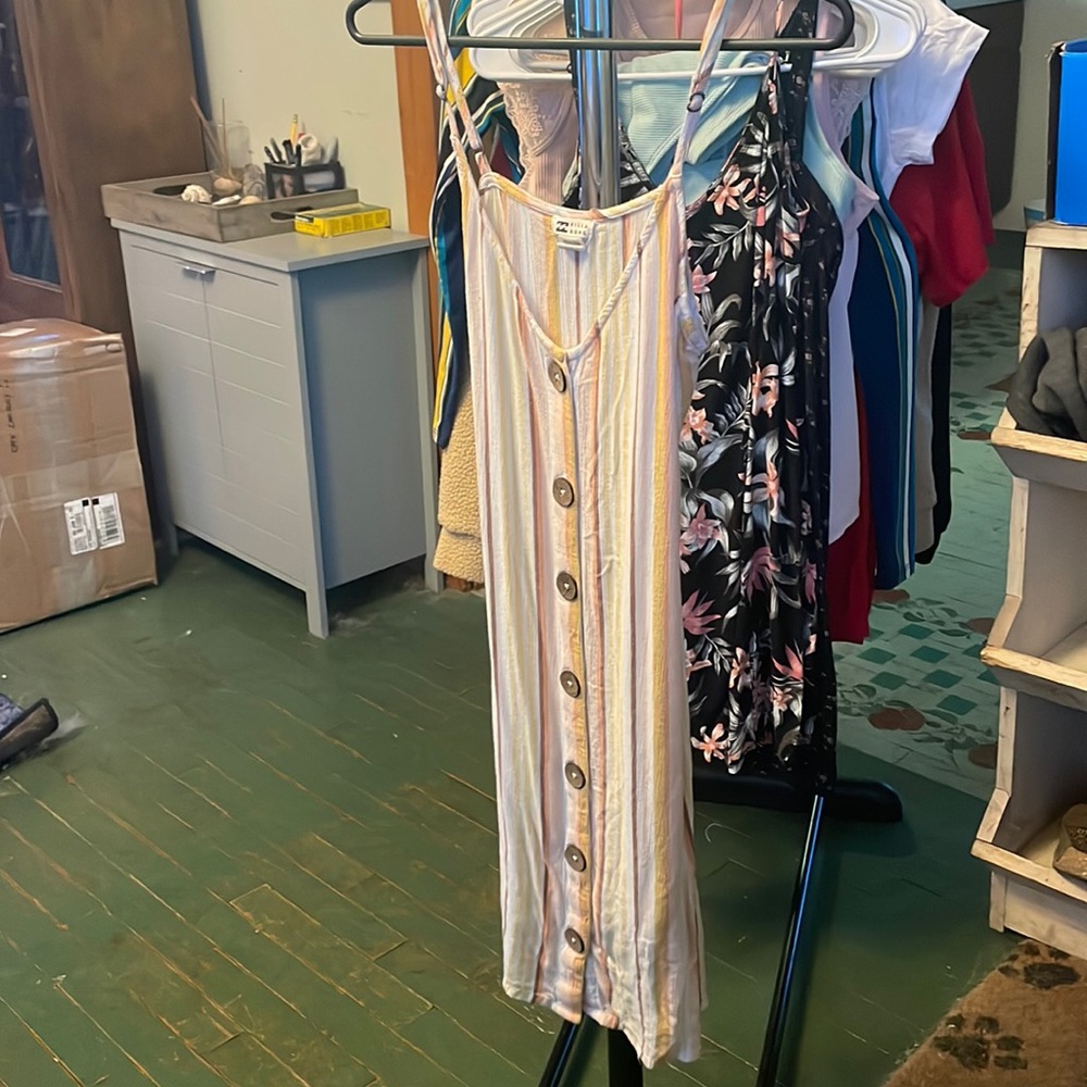 Striped knee length dress with cute wooden buttons on front.